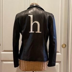 Black leather jacket with white letter h